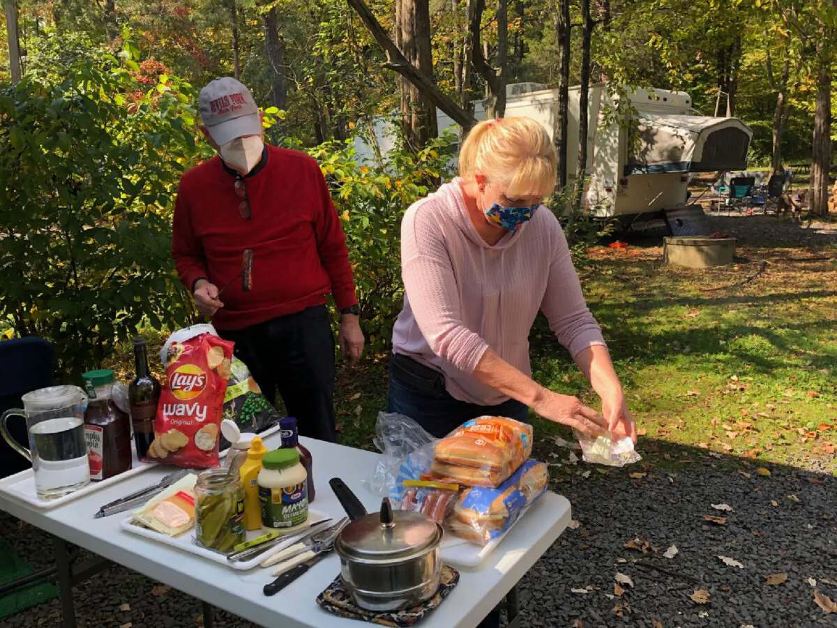 A family enjoys a masked picnic at an RV park. (Courtesy of Bill Neely)