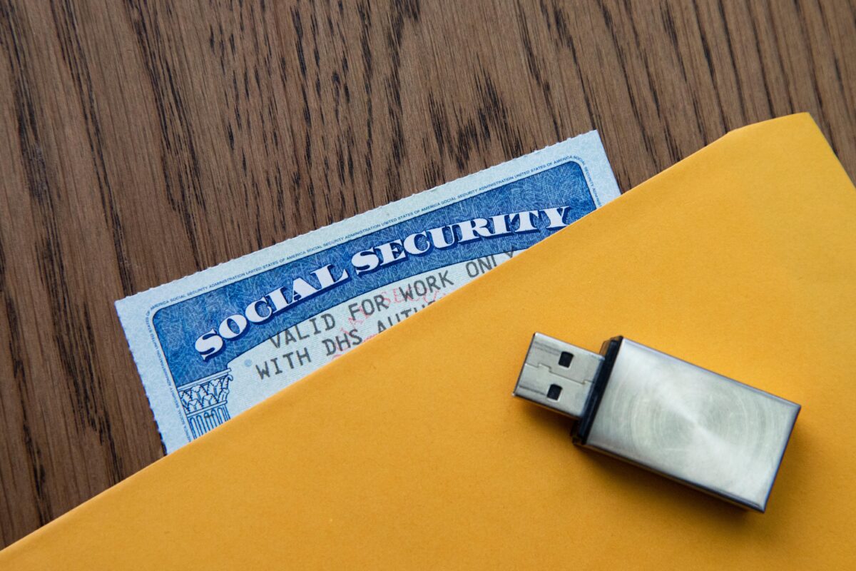 A social security card and a USB device in New York, on Feb. 14, 2021. (Chung I Ho/The Epoch Times)