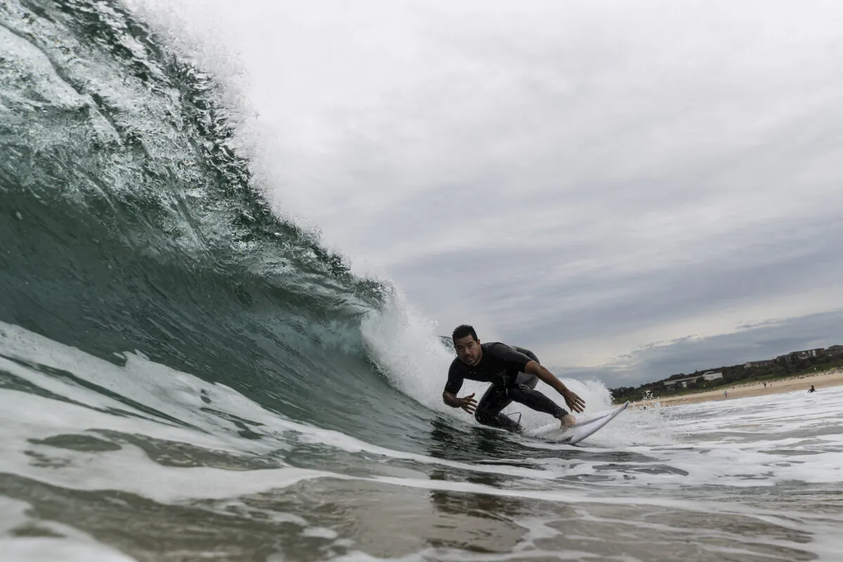 SYDNEY, AUSTRALIA - APRIL 20: A surfer rides a wave at Maroubra beach on April 20, 2020 in Sydney, Australia. Coogee, Maroubra and Clovelly beaches in Randwick council reopened today for exercise only. Several beaches in Sydney's Eastern suburbs were closed March 28, after large crowds were seen gathering at Bondi Beach despite social distancing orders in place to slow the spread of COVID-19. (Photo by Brook Mitchell/Getty Images)