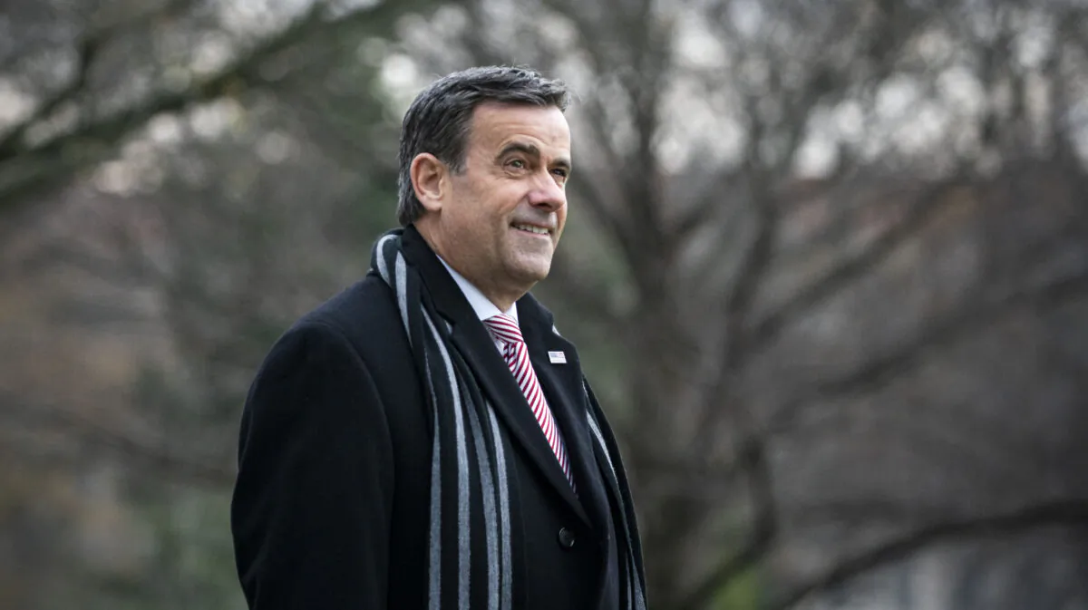 Director of National Intelligence John Ratcliffe follows behind U.S. President Donald Trump, not pictured, as they depart on the South Lawn of the White House in Washington on Dec. 12, 2020. (Al Drago/Getty Images)
