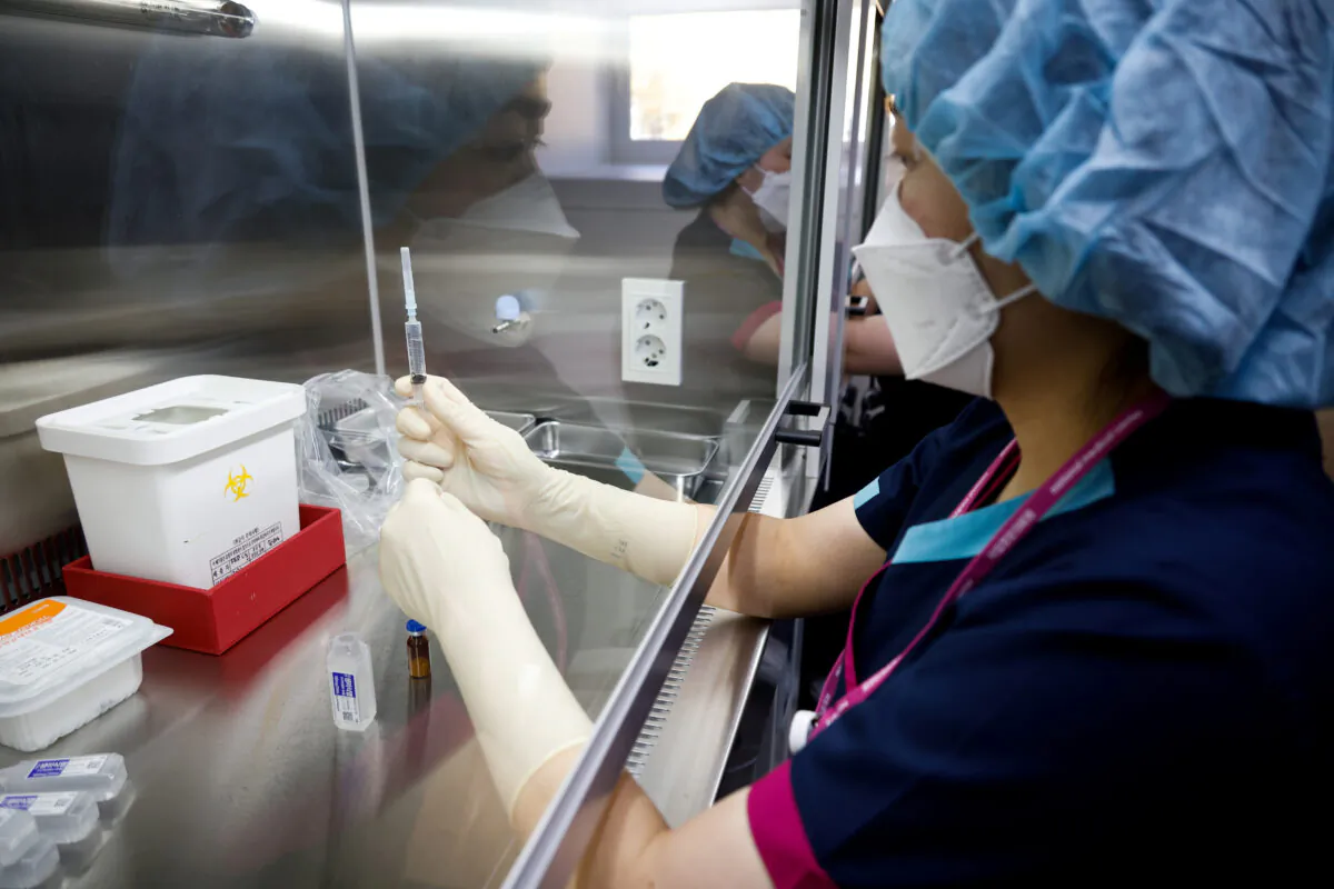 A nurse takes part in the coronavirus disease (COVID-19) vaccination mock drill at the COVID-19 vaccination center in Seoul, South Korea, on Feb. 9, 2021. (Kim Hong-Ji/Reuters/Pool/File Photo)