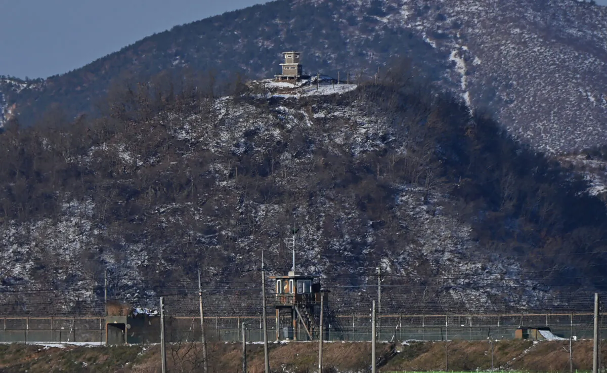 A North Korean guard post (top) is seen over a South Korean military fence (bottom) from the border city of Paju, on Dec. 15, 2020. (Jung Yeon-je/AFP via Getty Images)
