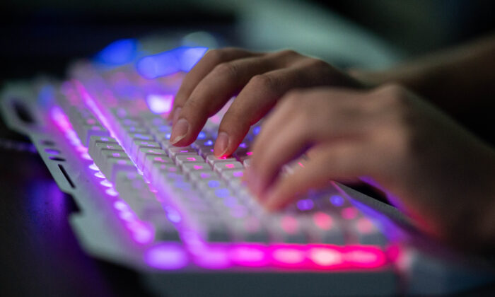 A hacker uses his computer in Dongguan, China, on Aug. 4, 2020. (Nicolas Asfouri/AFP via Getty Images)