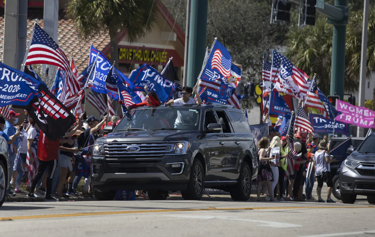 Supporters of former President Donald Trump gather along Southern Boulevard near Trump's Mar-a-Lago home in West Palm Beach, Fla., on Feb. 15, 2021. (Joe Raedle/Getty Images)
