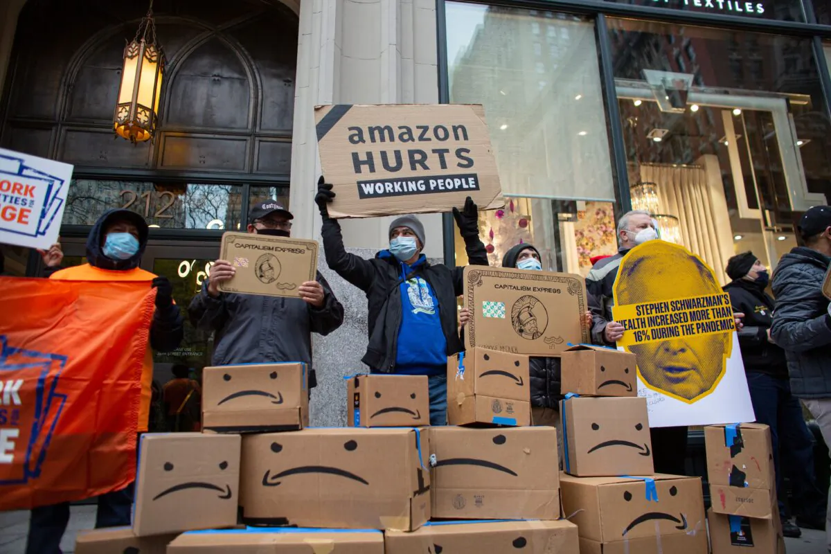Amazon workers and community allies demonstrate during a protest organized by New York Communities for Change and Make the Road New York in front of the Jeff Bezos' Manhattan residence in New York, on Dec. 2, 2020. (Kena Betancur/AFP via Getty Images)