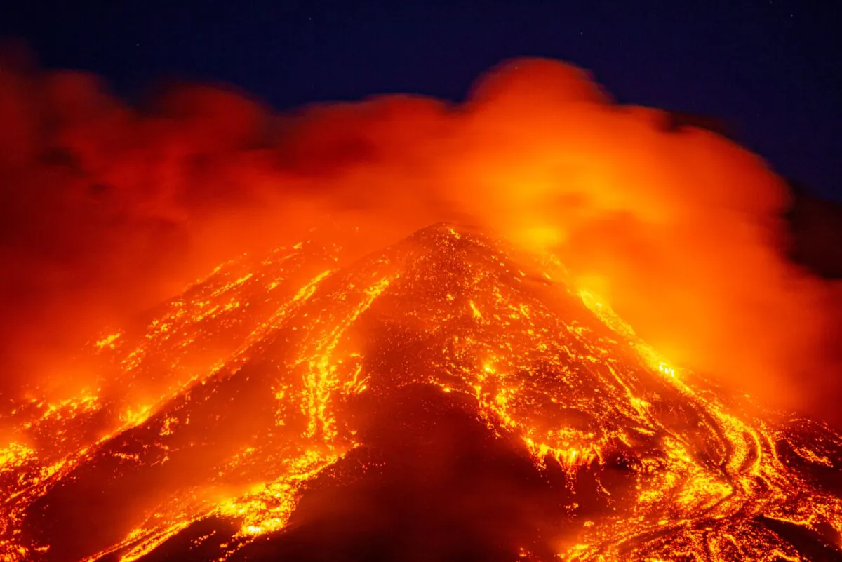 Lava gushes from the Mt Etna volcano near Catania, Sicily on Tue. Feb. 16, 2021. Europe's most active volcano came alive around 4 pm local time on Tuesday, according to the Italian Institute of Geophysics and Volcanology. (Salvatore Allegra/AP Photo)