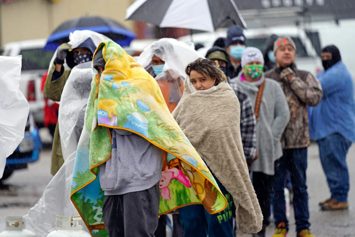 People wait in line to fill propane tanks in Houston, Texas, on Feb. 17, 2021. (David J. Phillip/AP Photo)