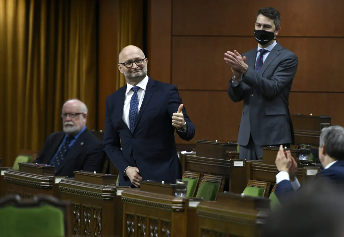 Minister of Justice David Lametti gives a thumbs up as he rises to vote in favour of a motion on Bill C-7, medical assistance in dying, in the House of Commons on Parliament Hill in Ottawa, Canada, on Dec. 10, 2020. (Justin Tang/The Canadian Press)