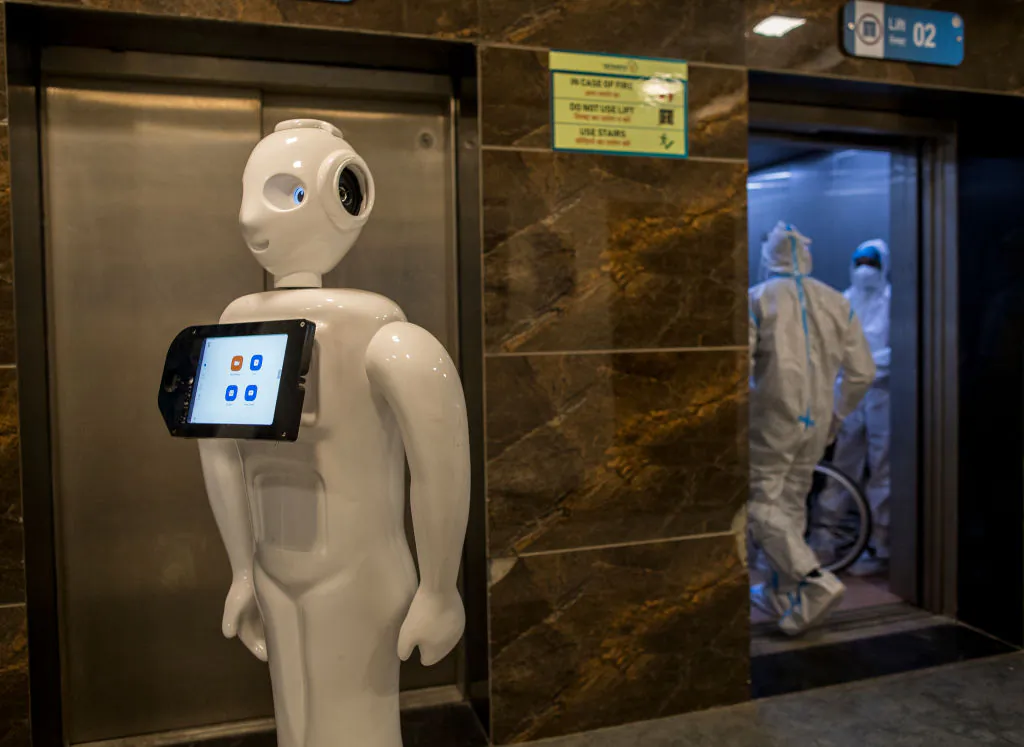 A robot designed to assist COVID-19 patients operates in the COVID-19 ward of a hospital in New Delhi, India, on Dec. 5, 2020. (Anindito Mukherjee/Getty Images)
