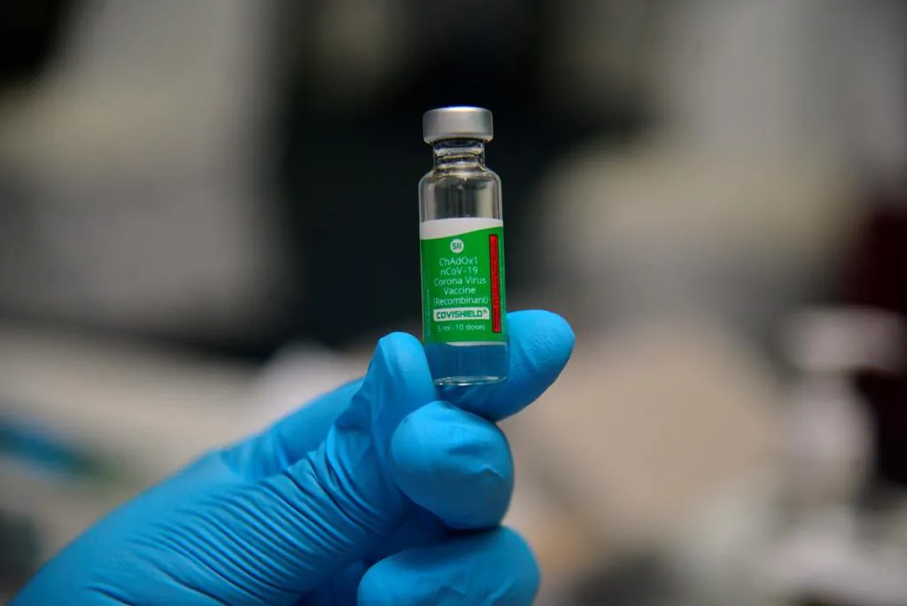 A nurse holds a dose of AstraZeneca vaccine before administering it to a tourist resort employee north of Port Louis, Mauritius, on Feb. 10, 2021. (Sumeet Mudhoo/L'express Maurice via AP)