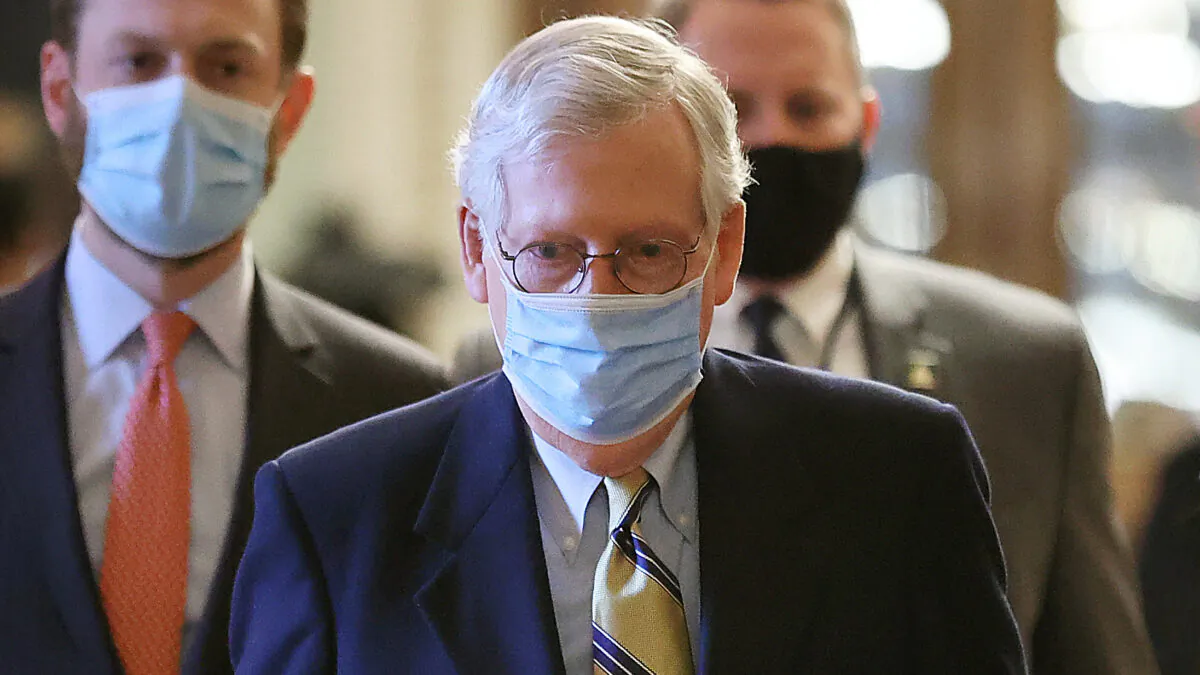 Senate Minority Leader Mitch McConnell (R-Ky.) walks to his office at the conclusion of former President Donald Trump's impeachment trial at the U.S. Capitol in Washington on Feb. 13, 2021. (Chip Somodevilla/Getty Images)