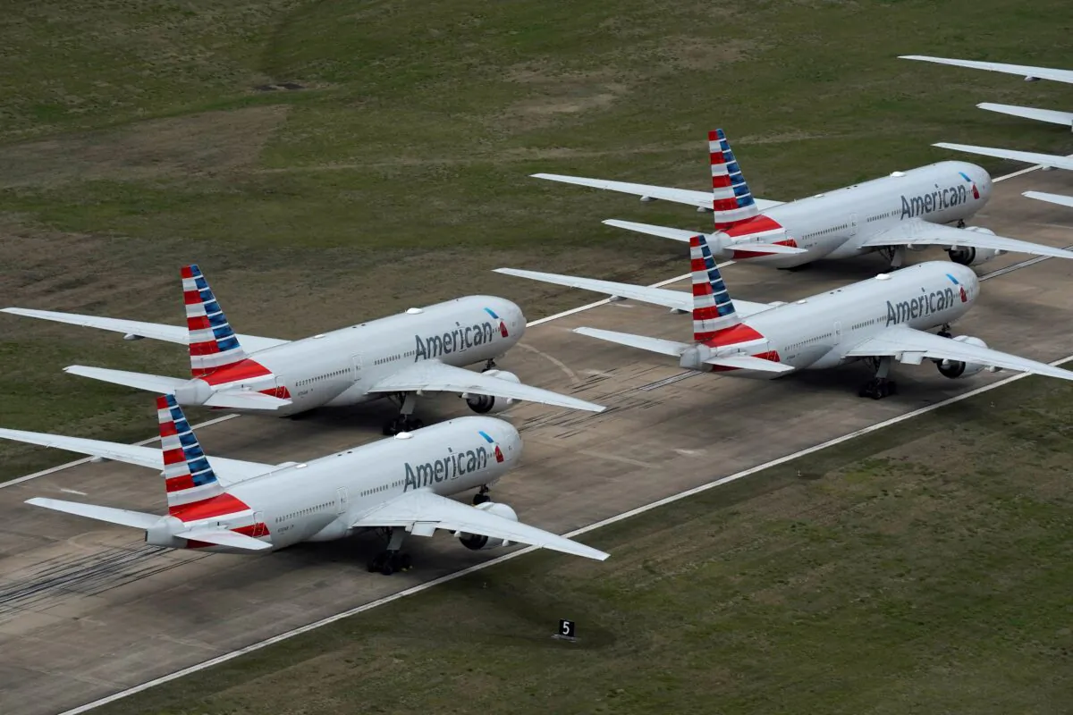 American Airlines passenger planes crowd a runway, at Tulsa International Airport in Tulsa, Okla., on March 23, 2020. (Nick Oxford/Reuters)