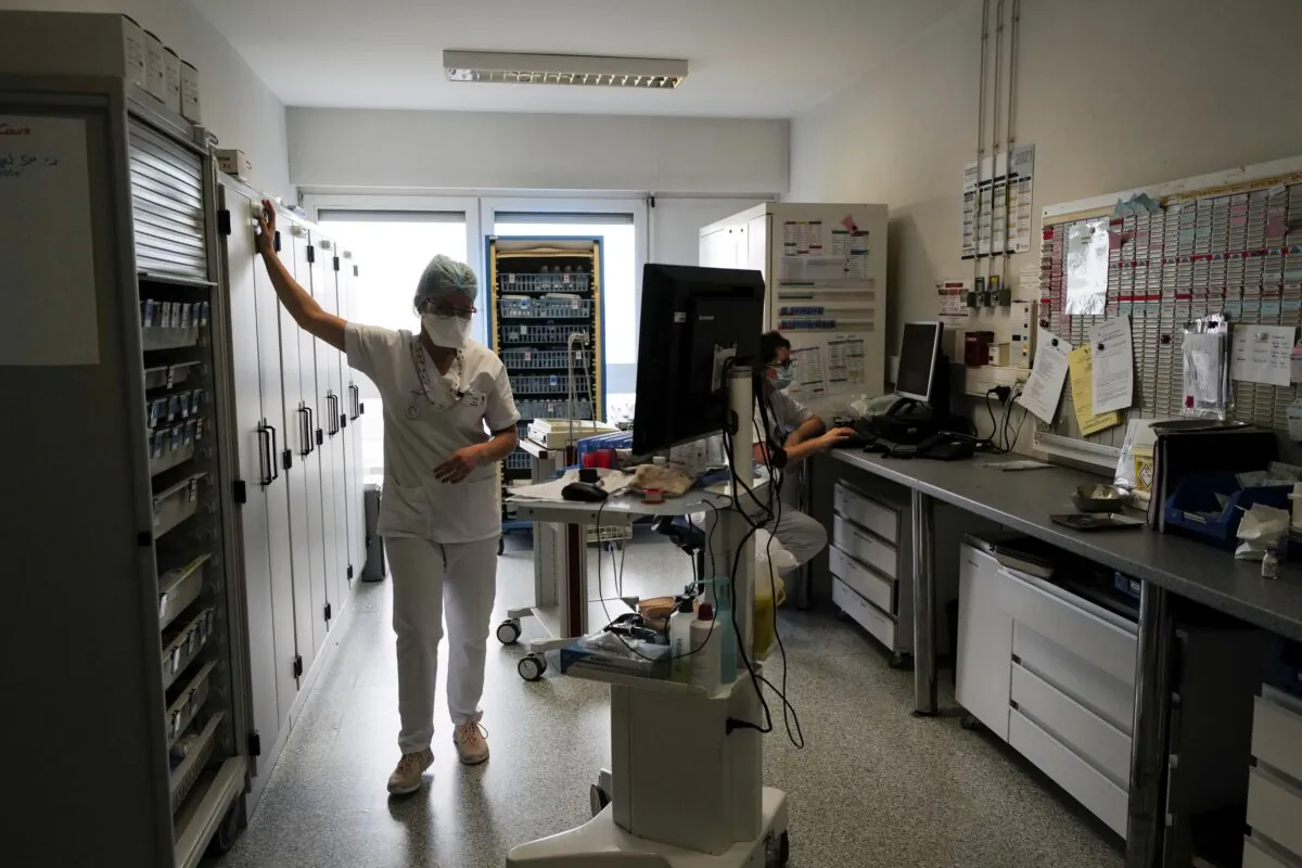 An intern prepares drugs for COVID-19 patients in the internal medicine department of the Emile Muller hospital in Mulhouse on Feb. 16, 2021. (Sebastien Bozon/ AFP via Getty Images)