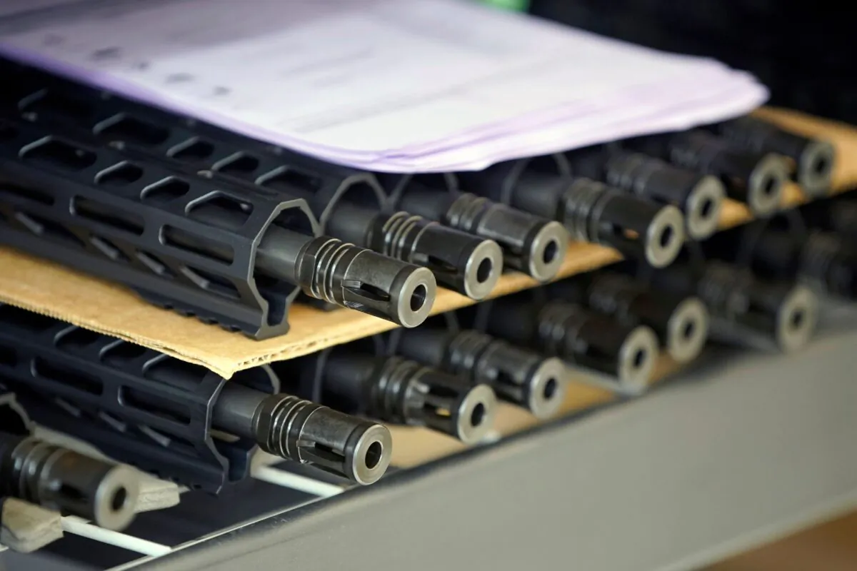 Rifle barrels sit on a shelf waiting to be assembled at Davidson Defense in Orem, Utah, on Feb. 4, 2021. (George Frey/AFP via Getty Images)