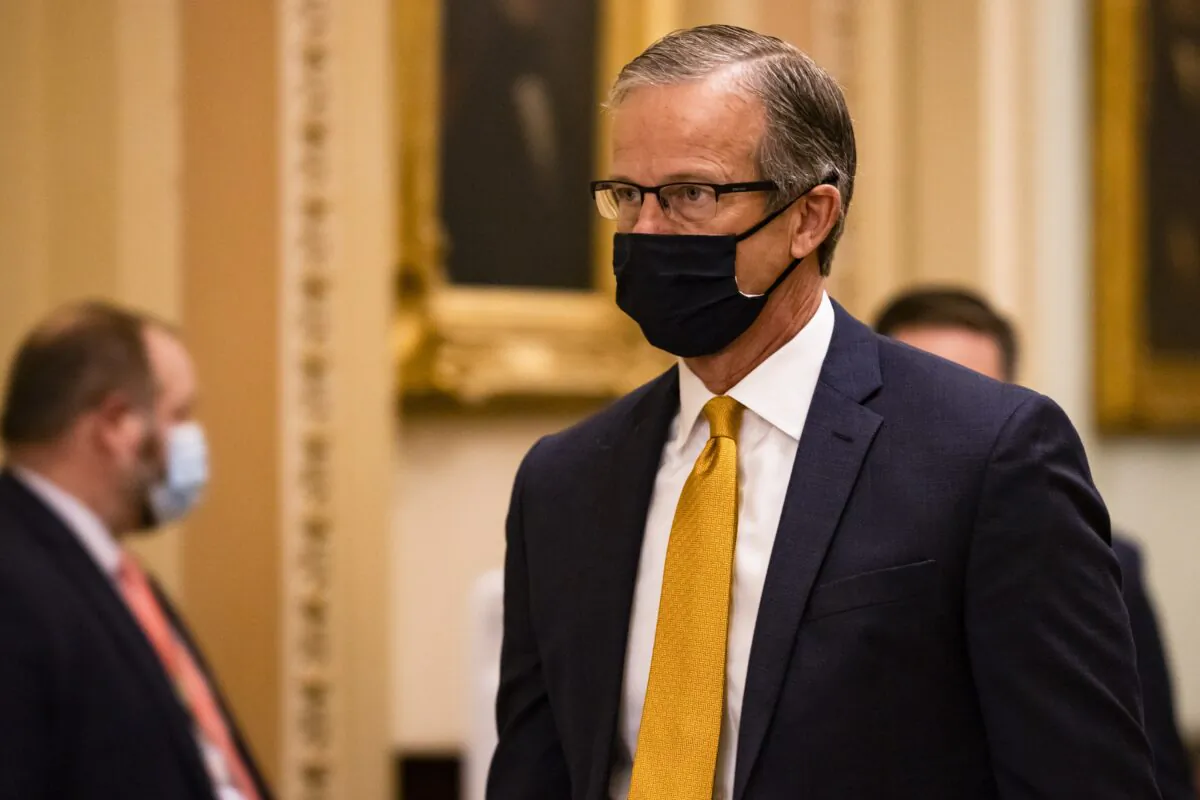 Senate Minority Whip John Thune (R-S.D.) walks to the Senate floor in Washington on Jan. 26, 2021. (Samuel Corum/Getty Images)