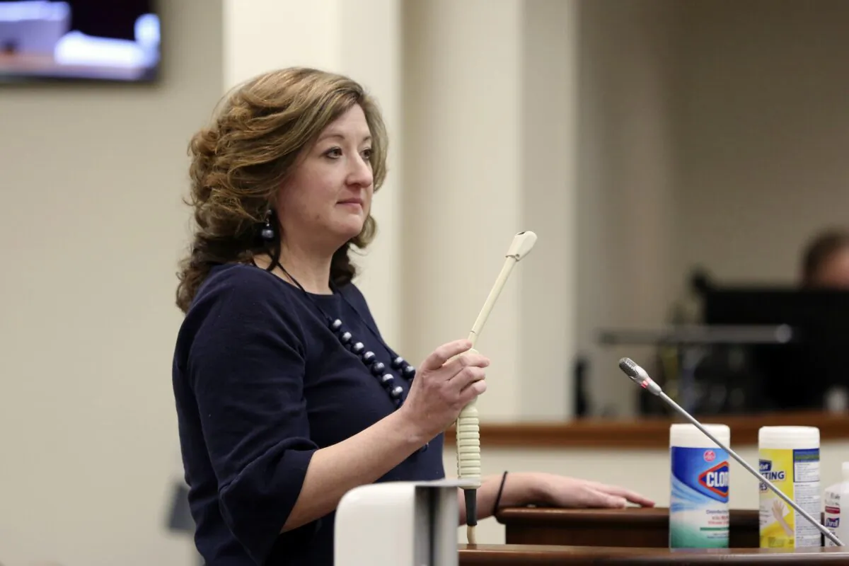 Melissa Anne Cunningham-Sereque shows the wand used to do ultrasound on pregnant women during a South Carolina House subcommittee hearing on an abortion bill in Columbia, S.C., on Feb. 3, 2021. (Jeffrey Collins/AP Photo)