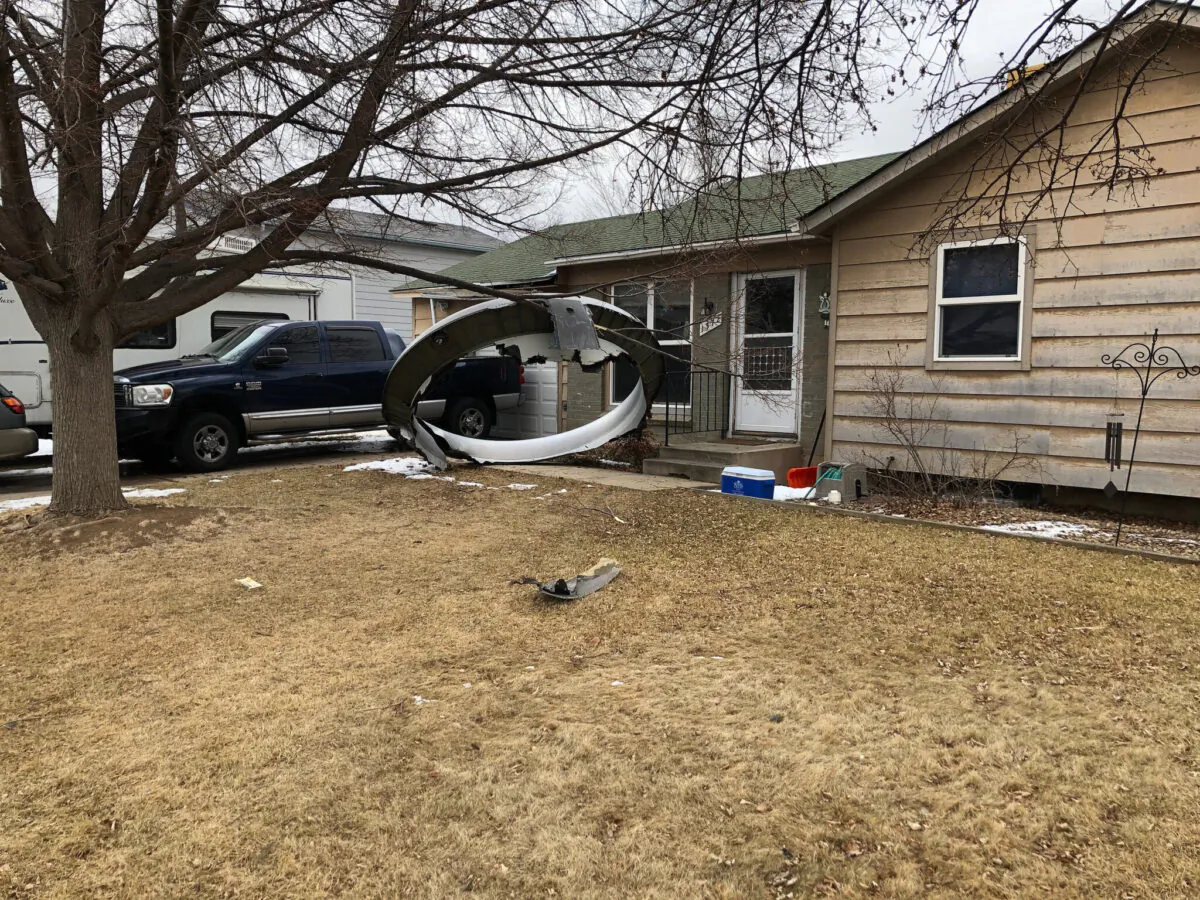 Debris is scattered in the front yard of a house at near 13th and Elmwood,  in Broomfield, Colo., on Feb. 20, 2021. 
 (Broomfield Police Department via AP)