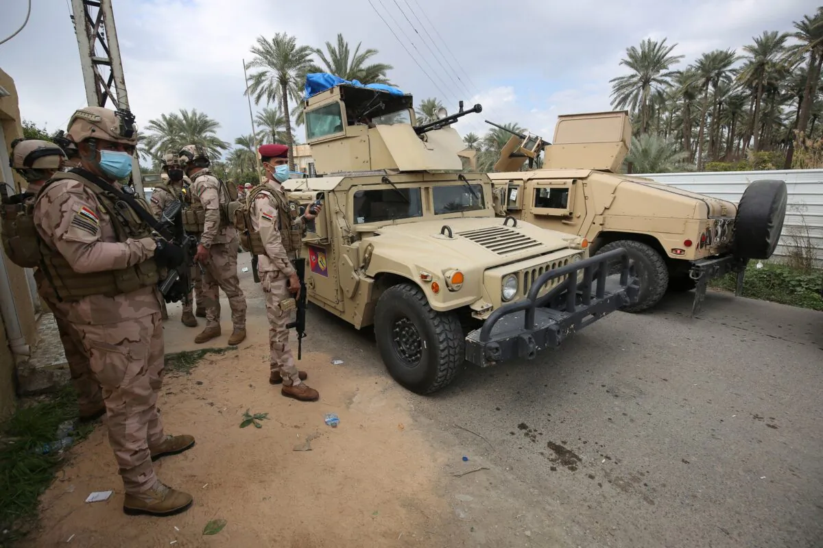 Iraqi forces search the area in Tarmiyah, 35 kilometres (20 miles) north of Baghdad, on Feb. 20, 2021. (Ahmad Al-Rubaye/AFP via Getty Images)