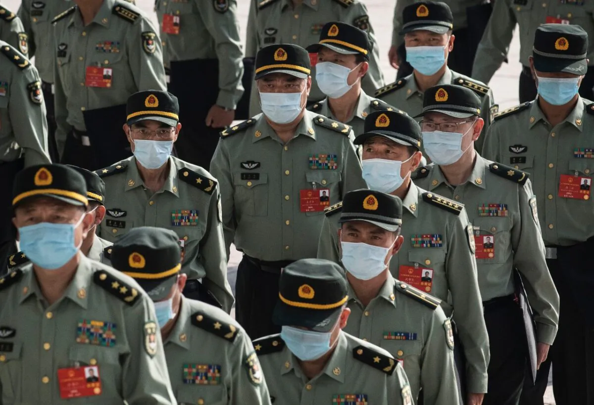 Members of China's armed forces arrive at the opening of the National People's Congress at the Great Hall of the People in Beijing on May 22, 2020. (Kevin Frayer/Getty Images)