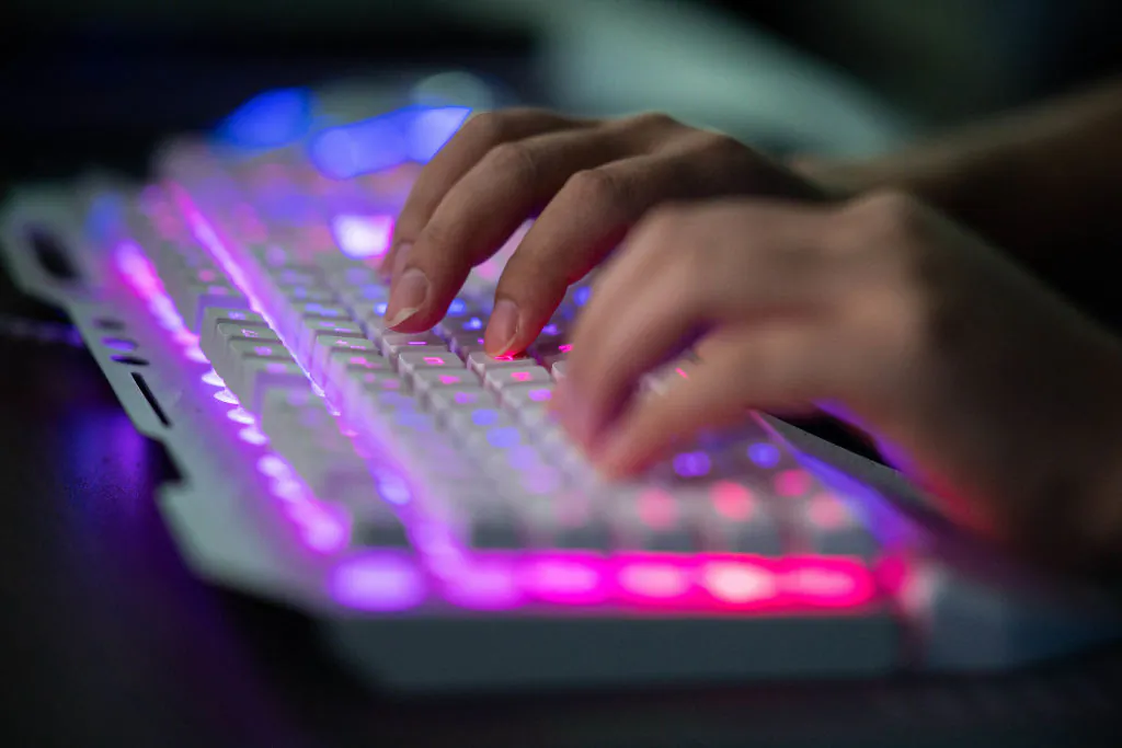 Prince, a member of the hacking group Red Hacker Alliance who refused to give his real name, uses his computer at their office in Dongguan, China, on Aug. 4, 2020. (Nicolas Asfouri/AFP via Getty Images)