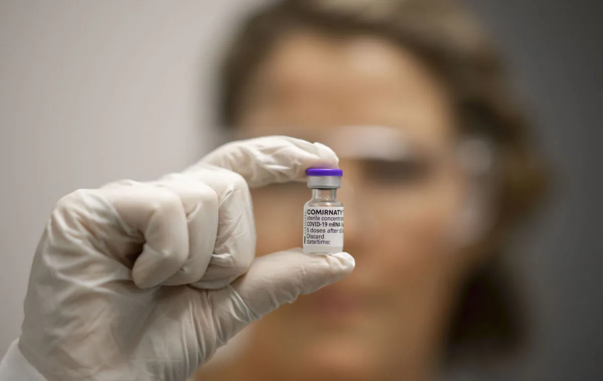 A vile of COVID-19 vaccine is held by Advanced Pharmacist Rachael Raleigh at Gold Coast University Hospital in Gold Coast, Australia, on Feb. 22, 2021. (Glenn Hunt/Getty Images)