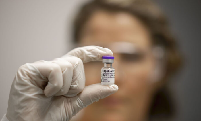 A vial of COVID-19 vaccine is held by Advanced Pharmacist Rachael Raleigh at Gold Coast University Hospital in Gold Coast, Australia, on Feb. 22, 2021. (Glenn Hunt/Getty Images)