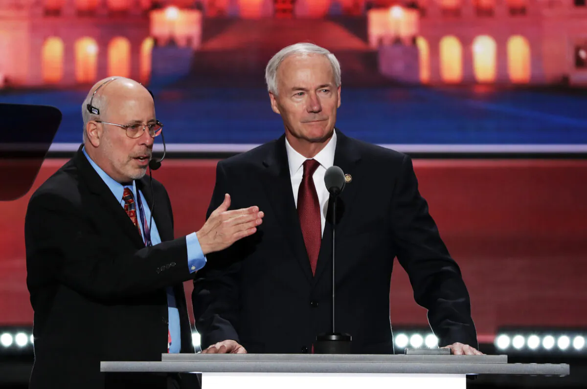 Arkansas Gov. Asa Hutchinson stands on stage prior to the start of the second day of the Republican National Convention at the Quicken Loans Arena in Cleveland, Ohio, on July 19, 2016. (Alex Wong/Getty Images)