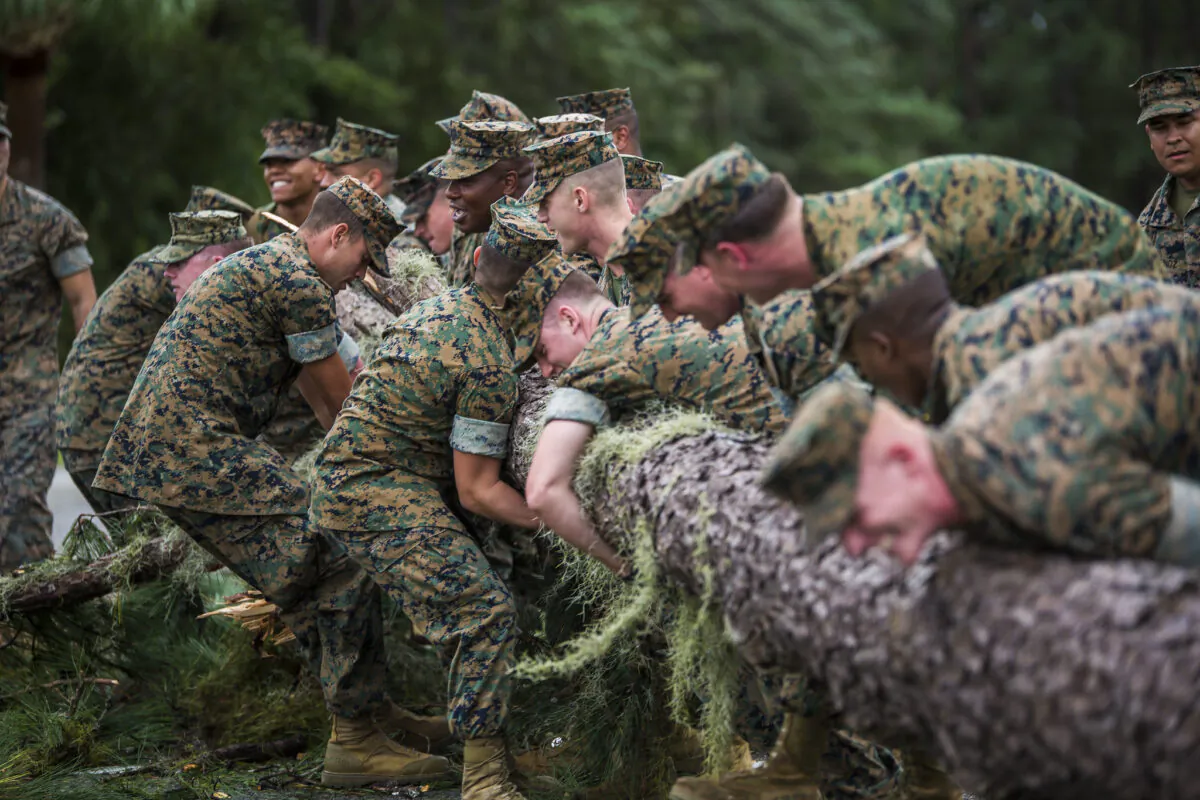 Some men who go through a shared experience, such as serving in the military, become lifelong friends. Above, Marines remove a tree from main road at Marine Corps Air Station Beaufort, South Carolina, Oct. 8, 2016. (Dengrier Baez/Marine Corps)