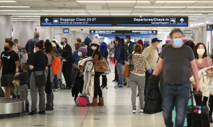 People gather their luggage after arriving at Miami International Airport on a plane from New York on Feb. 1, 2021. (Joe Raedle/Getty Images)