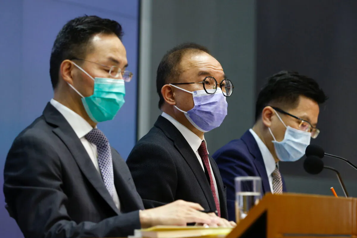 Secretary for Constitutional and Mainland Affairs Erick Tsang Kwok-wai (C) speaks during a news conference to announce changes to election and oath taking rules, in Hong Kong, on Feb. 23, 2021. (Tyrone Siu/Reuters)