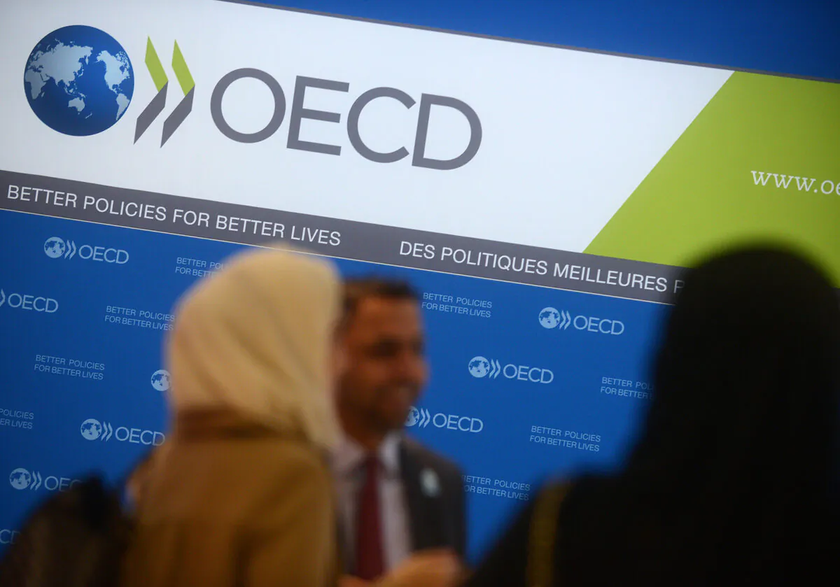 Guests arrive at the OECD headquarters in Paris on Nov. 27, 2013. (Antoine Antoniol/Getty Images)