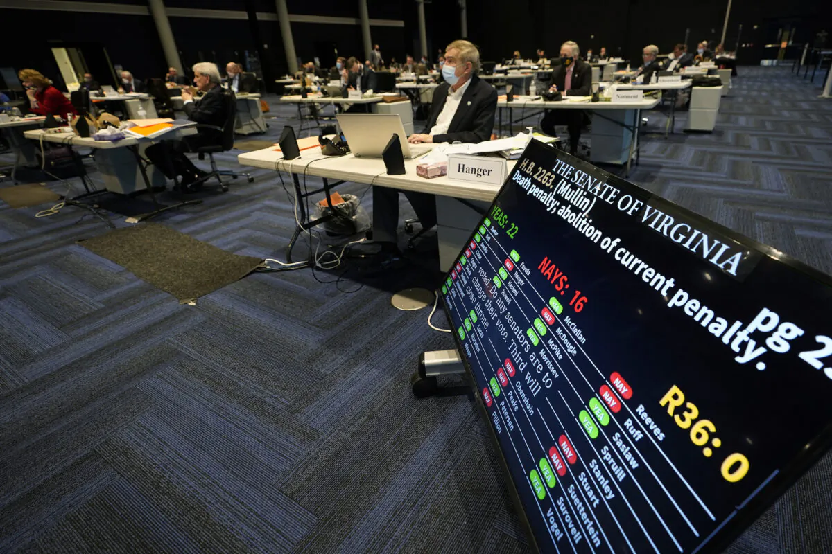 Sen. Emmett Hanger (R-Va.) looks at the vote tally board during a vote on a death penalty abolition bill at the Senate session in Richmond, Va., on Feb. 22, 2021. (Steve Helber/AP Photo)
