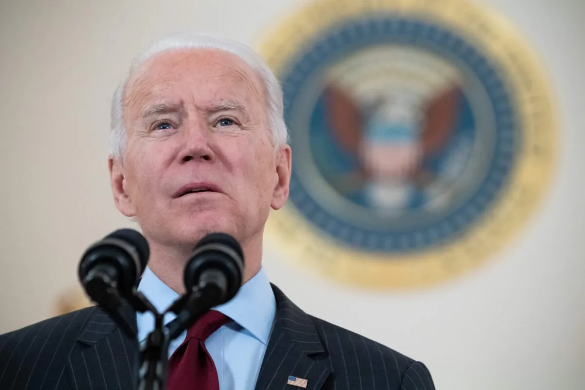 U.S. President Joe Biden speaks about American lives lost to COVID-19 as the national death toll passes 500,000 from the Cross Hall of the White House in Washington, on Feb. 22, 2021. (Saul Loeb/AFP via Getty Images)