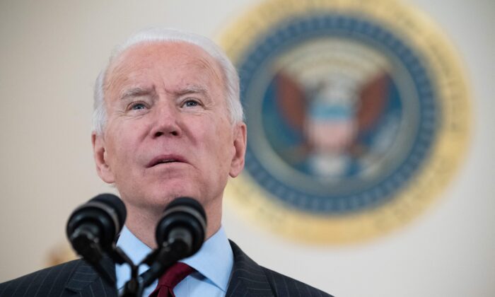 U.S. President Joe Biden speaks about American lives lost to COVID-19 as the national death toll passes 500,000 from the Cross Hall of the White House in Washington, on Feb. 22, 2021. (Saul Loeb/AFP via Getty Images)