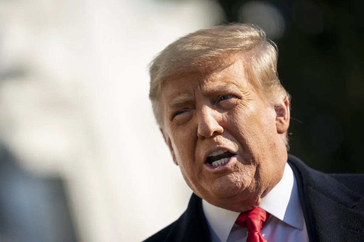 President Donald Trump speaks to reporters on the South Lawn of the White House before boarding Marine One in Washington, D.C., on Jan. 12, 2021. (Drew Angerer/Getty Images)