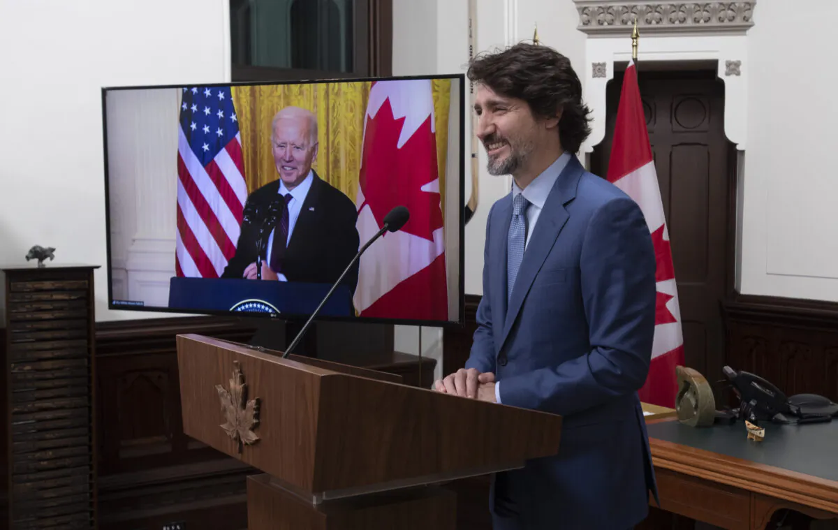 Canadian Prime Minister Justin Trudeau and United States President Joe Biden smile as they say farewell following a virtual joint statement in Ottawa on Feb. 23, 2021. (Adrian Wyld/The Canadian Press)