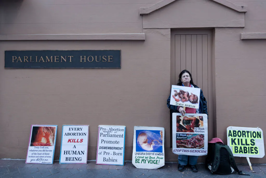 An anti-abortion protestor is pictured outside New South Wales Parliament House on August 20, 2019 in Sydney, Australia. (Brook Mitchell/Getty Images)
