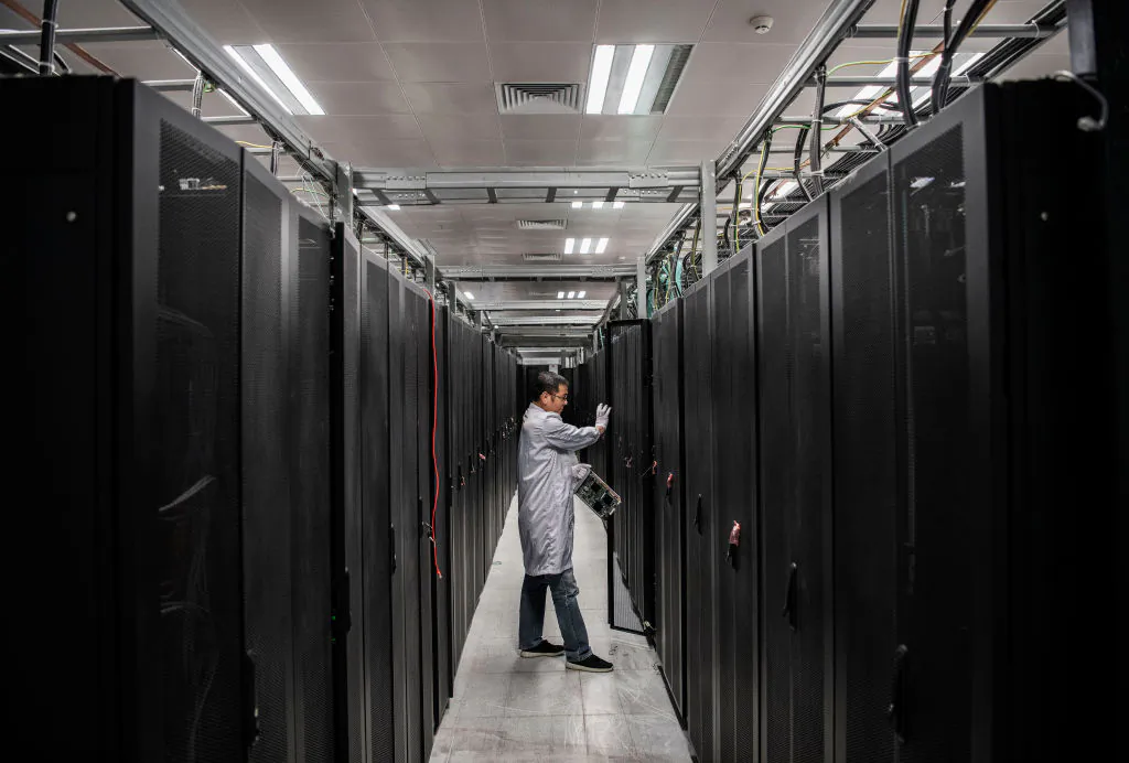 A Huawei engineer opens the door a server unit to display during an organized tour at the Cyber Security Lab of the company's production campus in Dongguan, near Shenzhen, China, on April 25, 2019. (Kevin Frayer/Getty Images)