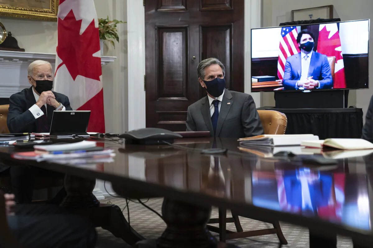 President Joe Biden and Secretary of State Antony Blinken listen as Canadian Prime Minister Justin Trudeau speaks during a virtual bilateral meeting, in the Roosevelt Room of the White House, in Washington on Feb. 23, 2021. (Evan Vucci/AP Photo)
