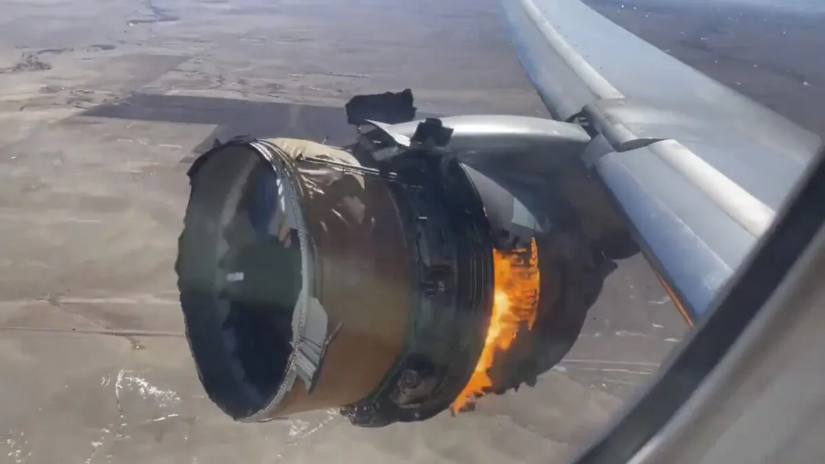 The engine of United Airlines Flight 328 is on fire after experiencing a "right-engine failure" shortly after takeoff from Denver International Airport in Denver, Colo., on Feb. 20, 2021. (Chad Schnell via AP)