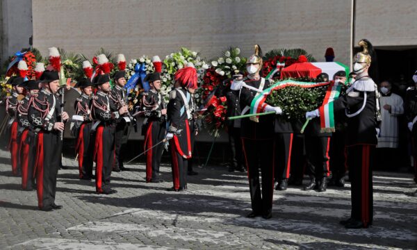 Carabinieri paramilitary police carry the caskets