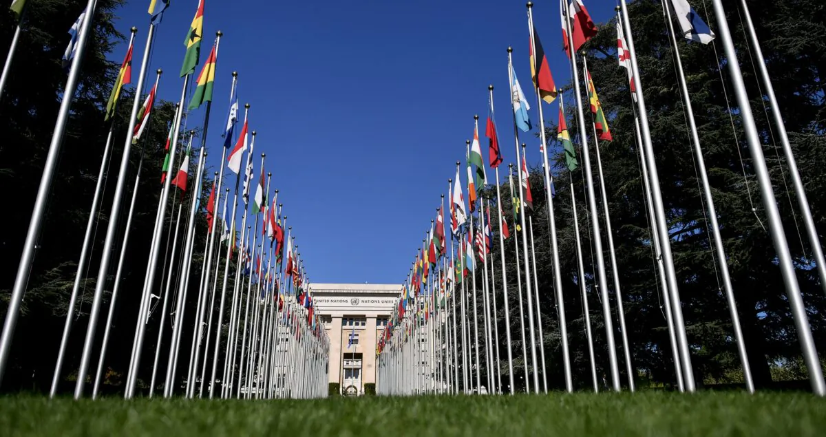 The "Palais des Nations", which houses the U.N. Offices, is seen at the end of the flag-lined front lawn in Geneva, Switzerland, on Sept. 4, 2018. (Fabrice Coffrini/AFP via Getty Images)
