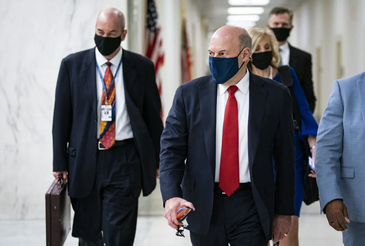 United States Postal Service Postmaster General Louis DeJoy departs following a hearing on Capitol Hill in Washington on Feb. 24, 2021. (Al Drago/Getty Images)