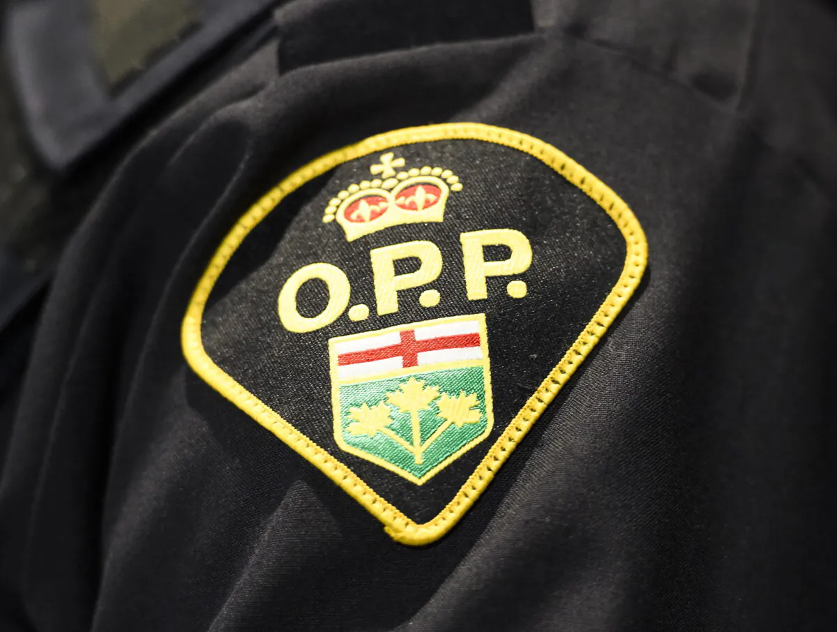 An Ontario Provincial Police logo is shown during a press conference in Barrie, Ont., Canada on April 3, 2019. (Nathan Denette/The Canadian Press)