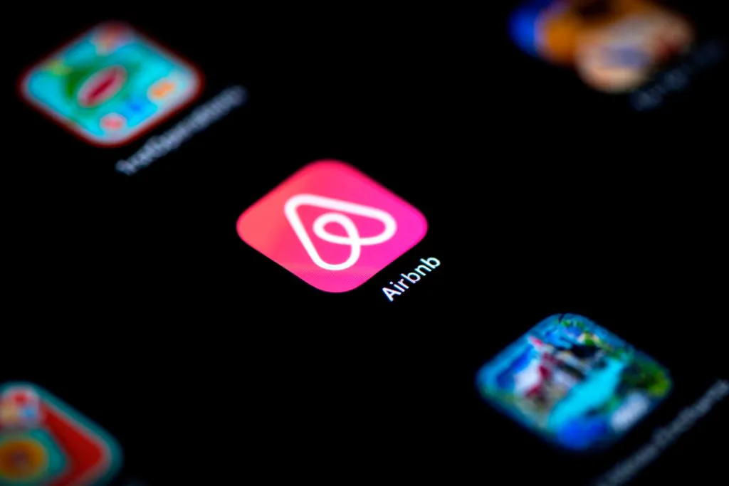 Logo of online lodging service Airbnb displayed on a smartphone in an undated file photo. (Lionel Bonaventure/AFP via Getty Images)