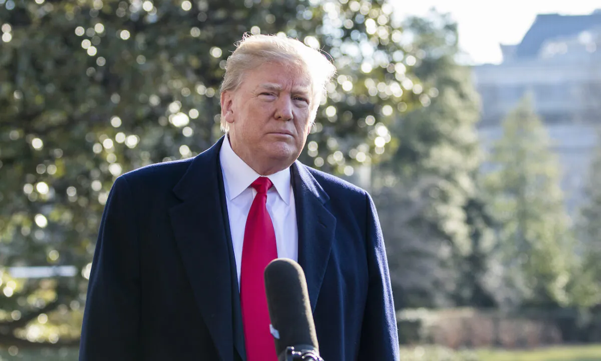 President Donald Trump speaks to the media before departing the White House to Joint Base Andrews, on March 13, 2018. (Samira Bouaou/The Epoch Times)