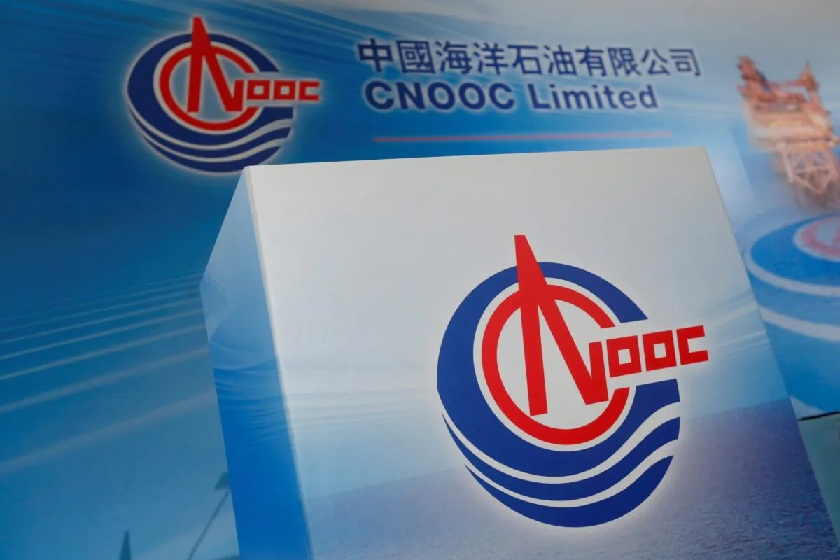 Logos of China National Offshore Oil Corporation (CNOOC) are displayed at a news conference on the company's interim results in Hong Kong, China, March 23, 2017. (Bobby Yip/Reuters)