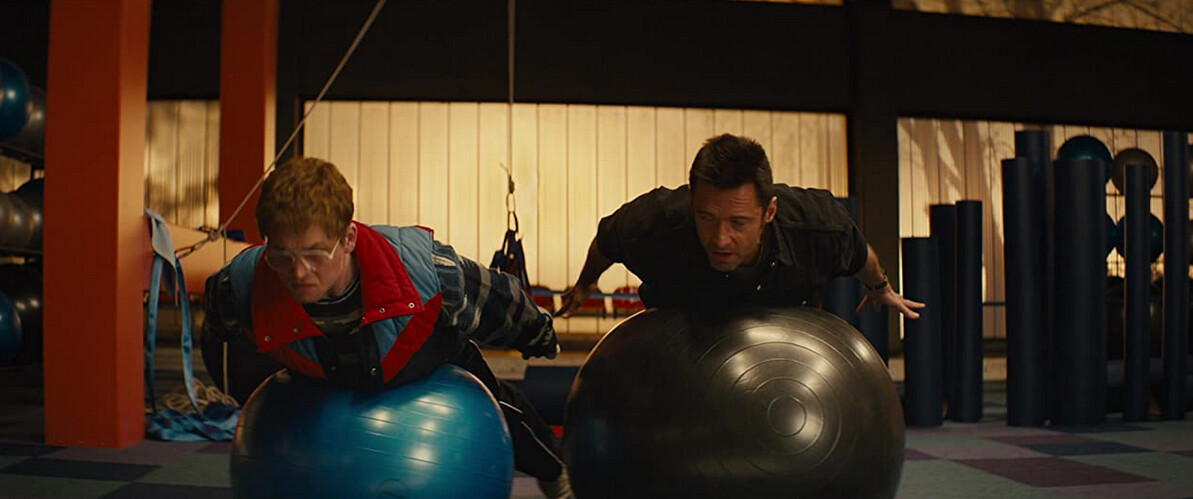 two men on stability balls in "Eddie the Eagle"