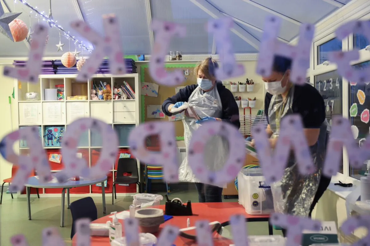 Nursery staff members at Little Stars Childcare take part in the Staffordshire County Council's pilot testing initiative to allow nurseries to test staff weekly, amidst the spread of the coronavirus disease (COVID-19), in Newcastle-under-Lyme, Staffordshire, Britain, on Feb. 15, 2021. (Carl Recine/Reuters)