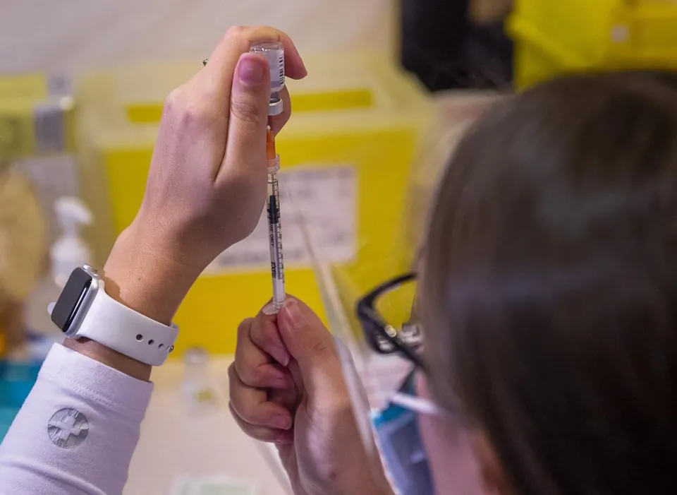 A COVID-19 vaccine shot is prepared in Halifax, Canada, on Feb. 22, 2021. (Andrew Vaughan/The Canadian Press)